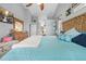 Spacious bedroom features a large bed, stylish decor, and plenty of natural light at 13542 Summerwood Ct, Hudson, FL 34667