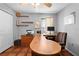 Home office with tiled floor, shelving, and a large desk at 13542 Summerwood Ct, Hudson, FL 34667