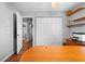 Office with open doorway to bathroom and storage closet at 13542 Summerwood Ct, Hudson, FL 34667