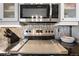 Modern oven with tile backsplash and ample storage space at 13542 Summerwood Ct, Hudson, FL 34667