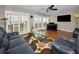 Inviting living room with hardwood floors, and sliding glass doors for natural light and views at 1451 Gulf Blvd # 207, Clearwater Beach, FL 33767