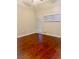 Bedroom featuring hardwood floors and two windows for natural light at 1914 E 4Th Ave # 2, Tampa, FL 33605