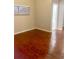 An empty bedroom featuring gleaming hardwood floors and a bright window at 1914 E 4Th Ave # 2, Tampa, FL 33605