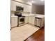 Well-equipped kitchen featuring stainless steel appliances and white cabinetry with a tile floor at 1914 E 4Th Ave # 2, Tampa, FL 33605