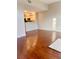 An open concept living room featuring hardwood floors that connects to the kitchen at 1914 E 4Th Ave # 2, Tampa, FL 33605