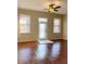 Bright living room featuring hardwood floors, lots of natural light, and a ceiling fan at 1914 E 4Th Ave # 2, Tampa, FL 33605