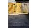 Back yard has a stone patio and is surrounded by a new and old fence at 204 Pine Tulip Ct # 102, Tampa, FL 33612