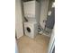 A compact stacked washer and dryer unit provides laundry convenience at 204 Pine Tulip Ct # 102, Tampa, FL 33612