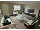 Well-lit living room features modern decor and sleek furniture, perfect for relaxation and entertainment at 204 Pine Tulip Ct # 102, Tampa, FL 33612