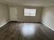 The living room features laminate wood flooring and plenty of natural light at 204 Pine Tulip Ct # 102, Tampa, FL 33612