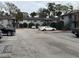 Community parking lot with multiple vehicles and the buildings in the background at 204 Pine Tulip Ct # 102, Tampa, FL 33612