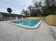 Outdoor pool featuring a paved patio and partially enclosed by a wooden fence at 204 Pine Tulip Ct # 102, Tampa, FL 33612