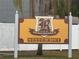 Outdoor sign for Renaissance Condominiums in a yellow color with brown accents at 204 Pine Tulip Ct # 102, Tampa, FL 33612