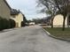 Street view within the community with buildings visible on both sides at 204 Pine Tulip Ct # 102, Tampa, FL 33612