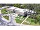 Aerial image featuring lush landscaping and manicured lawns around this complex at 2201 Pine Dr, Tarpon Springs, FL 34689