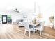 Inviting living room featuring skylights, a dining area, and seamless access to the outdoors at 2201 Pine Dr, Tarpon Springs, FL 34689