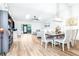 Spacious living room with bright skylights, open floor plan, and dining area for easy entertaining at 2201 Pine Dr, Tarpon Springs, FL 34689