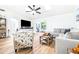 Spacious living room with modern furniture, entertainment center, and a comfortable layout at 2201 Pine Dr, Tarpon Springs, FL 34689