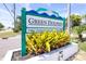 Signage for Green Dolphin Villas, Garden & Golf Court Condominiums at 2201 Pine Dr, Tarpon Springs, FL 34689