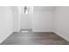 Bright bedroom with wood-look floors, dormer style window, and white trim at 23 N Edwards St, Plant City, FL 33563