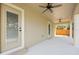Covered patio features a ceiling fan and access doors to the home's interior at 23 N Edwards St, Plant City, FL 33563