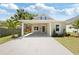 Charming home featuring a covered carport, new landscaping, and craftsman architecture at 23 N Edwards St, Plant City, FL 33563