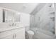 Modern bathroom featuring a shower-tub combination with decorative tile and updated vanity at 25 W Edwards St, Plant City, FL 33563
