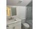 Bathroom features a modern vanity and combined shower-tub at 25 W Edwards St, Plant City, FL 33563