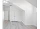 Bright bedroom with wood-look tile flooring and double door closet at 25 W Edwards St, Plant City, FL 33563