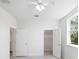 Bright bedroom features a ceiling fan and two closets for ample storage space at 25 W Edwards St, Plant City, FL 33563