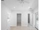 Bedroom with tile flooring, with three different doors and entrances at 25 W Edwards St, Plant City, FL 33563