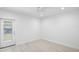 Bright bedroom with tile flooring, a ceiling fan, and a door to the backyard at 25 W Edwards St, Plant City, FL 33563