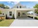 Charming home with a covered porch, well-manicured lawn, and updated landscaping at 25 W Edwards St, Plant City, FL 33563