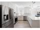 Bright kitchen boasts stainless steel appliances, modern cabinets, and a large countertop with pendant lighting at 25 W Edwards St, Plant City, FL 33563
