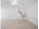 Spacious living room with wood flooring and staircase at 25 W Edwards St, Plant City, FL 33563
