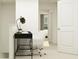 Bright hallway featuring a black work station, white chair, and neutral carpet at 2641 Buttercup Lucine Ln, Ruskin, FL 33570