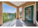 Private balcony with green railings, offering views of the water and surrounding landscape at 2733 Via Cipriani # 814A, Clearwater, FL 33764