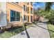 Beautiful condo building with well-maintained landscaping and a paved walkway at 2733 Via Cipriani # 814A, Clearwater, FL 33764
