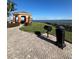 Charming outdoor gazebo and grilling area with lush landscaping and stunning waterfront views at 2733 Via Cipriani # 814A, Clearwater, FL 33764
