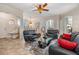Comfortable living room with modern black seating, glass coffee table, and an open layout at 2733 Via Cipriani # 814A, Clearwater, FL 33764