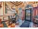 Elegantly designed lobby with decorative artwork, tile flooring, and decorative columns at 2733 Via Cipriani # 814A, Clearwater, FL 33764