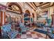 Stunning lobby with ornate columns, high ceilings, marble floors, and decorative chandeliers at 2733 Via Cipriani # 814A, Clearwater, FL 33764