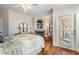 Spacious main bedroom with fireplace, comfy chair, and a private balcony offering outdoor views at 2733 Via Cipriani # 814A, Clearwater, FL 33764
