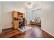 Bright office features a desk, overhead storage, and hardwood flooring at 2733 Via Cipriani # 814A, Clearwater, FL 33764