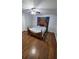 Charming bedroom featuring hardwood floors, a ceiling fan, and comfortable furnishings at 3001 W Chestnut St, Tampa, FL 33607