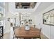 Bright dining area featuring a wooden table, kitchen, and view to the outdoor patio at 3117 W Barcelona St # A, Tampa, FL 33629