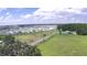Aerial view of community showing peaceful country road with green spaces nearby at 32817 Leonard Rd, San Antonio, FL 33576