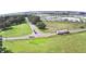 Community aerial view showing surrounding green space and pond views at 32817 Leonard Rd, San Antonio, FL 33576