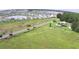 Aerial view of community featuring peaceful country road and ample green spaces at 32817 Leonard Rd, San Antonio, FL 33576