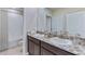 Elegant bathroom with double sinks, granite countertops, and a separate shower and tub at 3310 Amber Waves Dr, Plant City, FL 33565